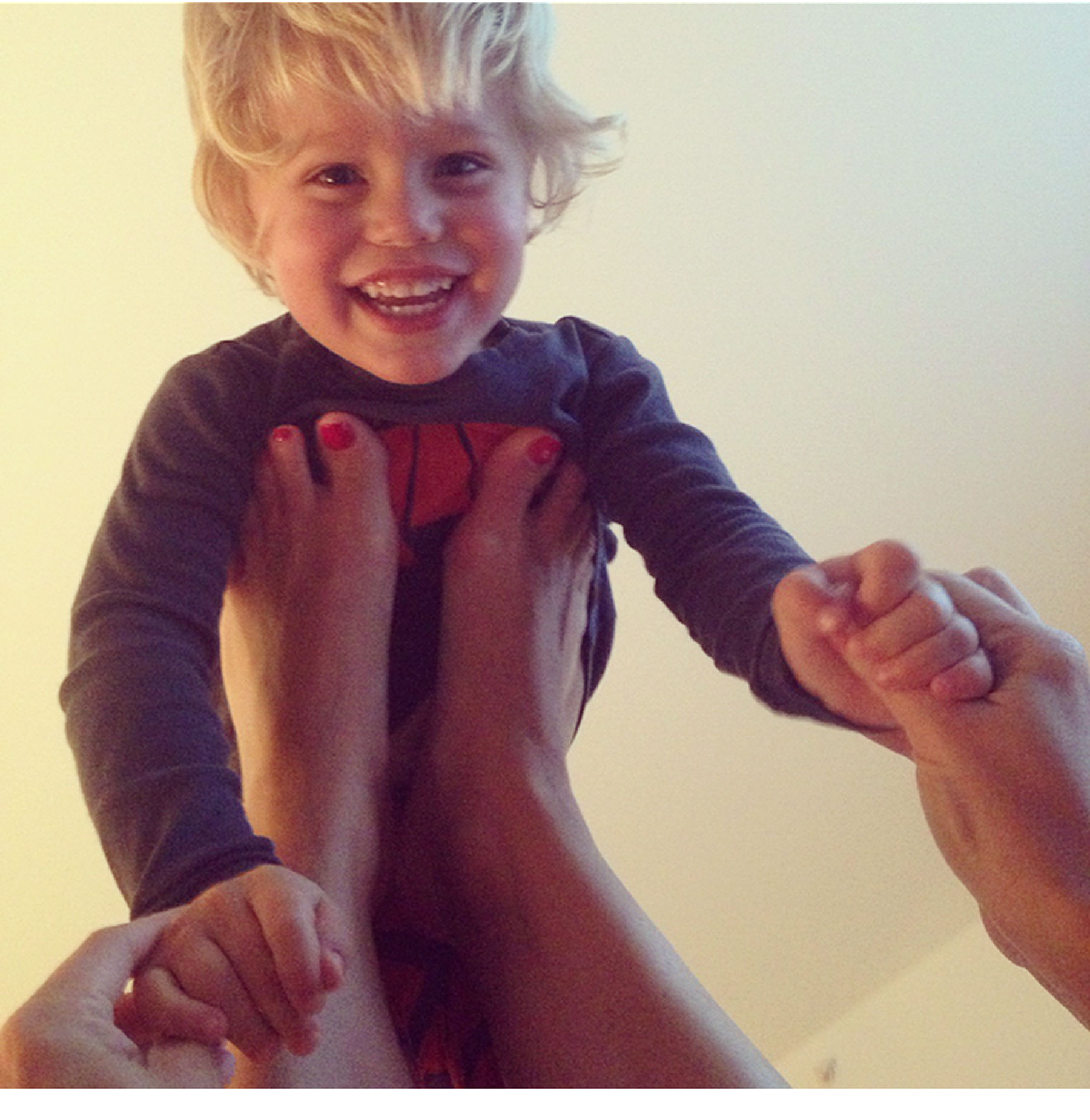 A Day in the Life of Ceci Johnson - 8:00 PM Back home in time to play with Mason a little more and put him to bed with the help of my husband, Alan (who kindly took this photo). These smiles and family moments are so special and make everything worth it.